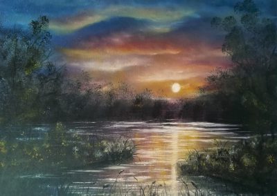 Evening Light. Oilpainting of a sunset at a lake with many colours, blue, red ,yellow , green, purple on canvas 50x40cm.