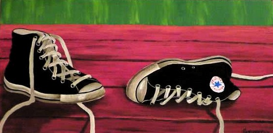 Noelle's Shoes realistic painting of a pair of shoes. They are black All Stars and lay on a red table. The background is green, canvas 60x20cm. by Lia van Elffenbrinck