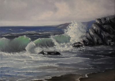 palette knife oil painting of a sea shore on canvas 50x40cm. by Lia van Elffenbrinck, cloudy grey sky, blue green grey waves, browny rocks and sand
